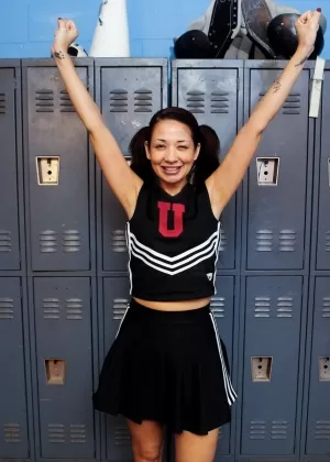 Clothed Asian MILF Coco Velvet flashing upskirt ass in cheerleader outfit