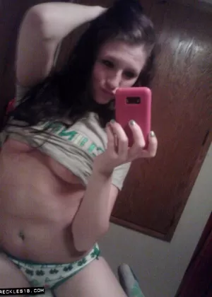 Amateur girl Freckles 18 takes selfies while going topless in cute panties