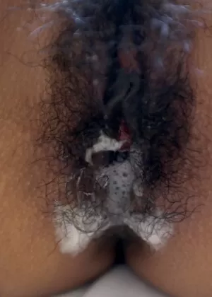 Redheaded Asian girl Puy is left with cum on her pussy after fucking a Farang