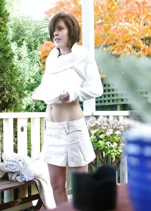 Amateur babe Brandy removing her bra and panties outdoors as seen by voyeur