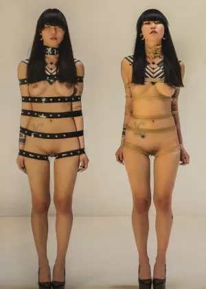 Naked Japanese female Carmine Worx is restrained with her arms to her side