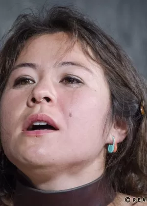 Pain slut Tess Dagger is stripped to hose while held in bondage