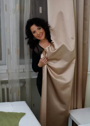 Hot mature woman gives a wicked upskirt and shows her aging ass