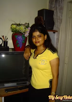 Indian girl Heha puts a smile on her pretty face during non nude poses