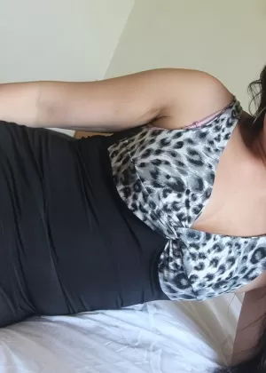 Busty Thai chick with a bald pussy sucks the nut sac while giving a BJ