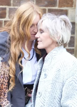 Mature lesbians flash upskirts on stairs while walking out in public