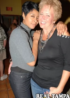 Horny granny enjoying some interracial sex fun at a steamy swingers orgy