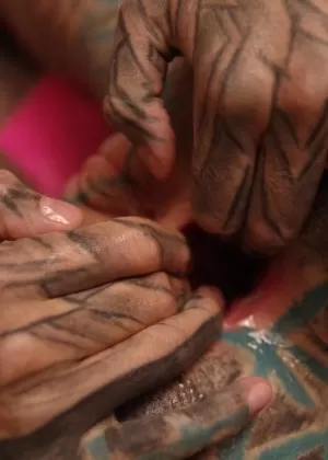 Heavily tattooed female stretches out her gaped asshole with fingers