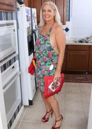Horny mature housewife Judy Mayflower masturbates with kitchen implements