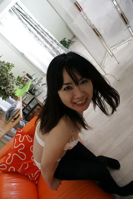 Naughty asian MILF strips down and gets her hairy slit fingered