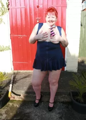 Older redhead Valgasmic Exposed flashes her cute undies before baring her tits