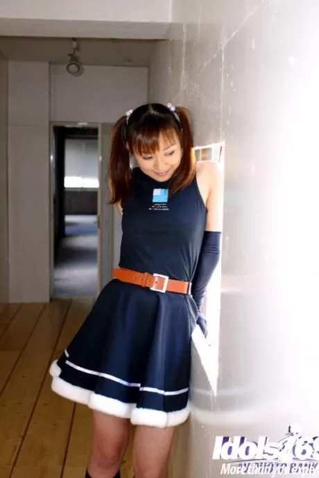 Seductive asian cheerleader uncovering her tiny tits and hairy cunt