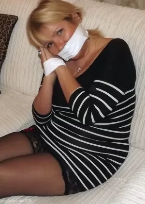 Fat older blonde displays her large tits while tied up and cleave gagged