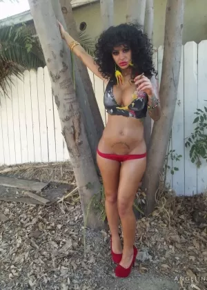 Latina girl Angelina Valentine touts her booty while on the street in a bikini